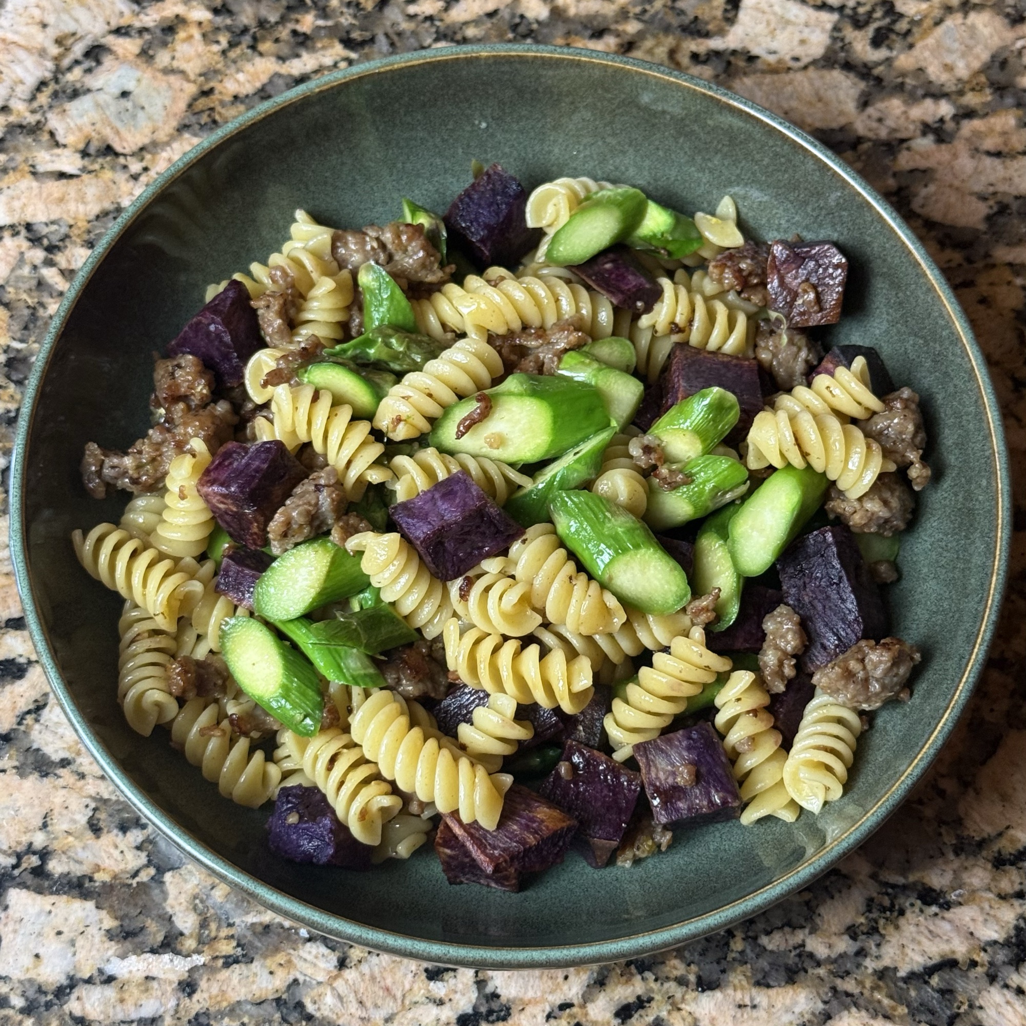 Pasta with asparagus and purple sweet potato, prepared by Doble Culinary